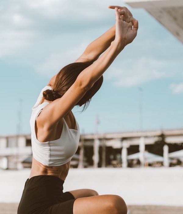 Woman in a calm yoga pose, embodying flexibility and peace.